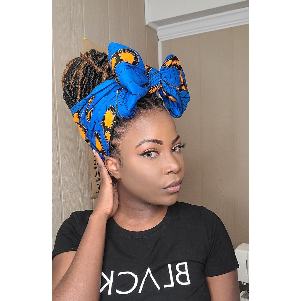 Black woman in Blue and yellow headwrap